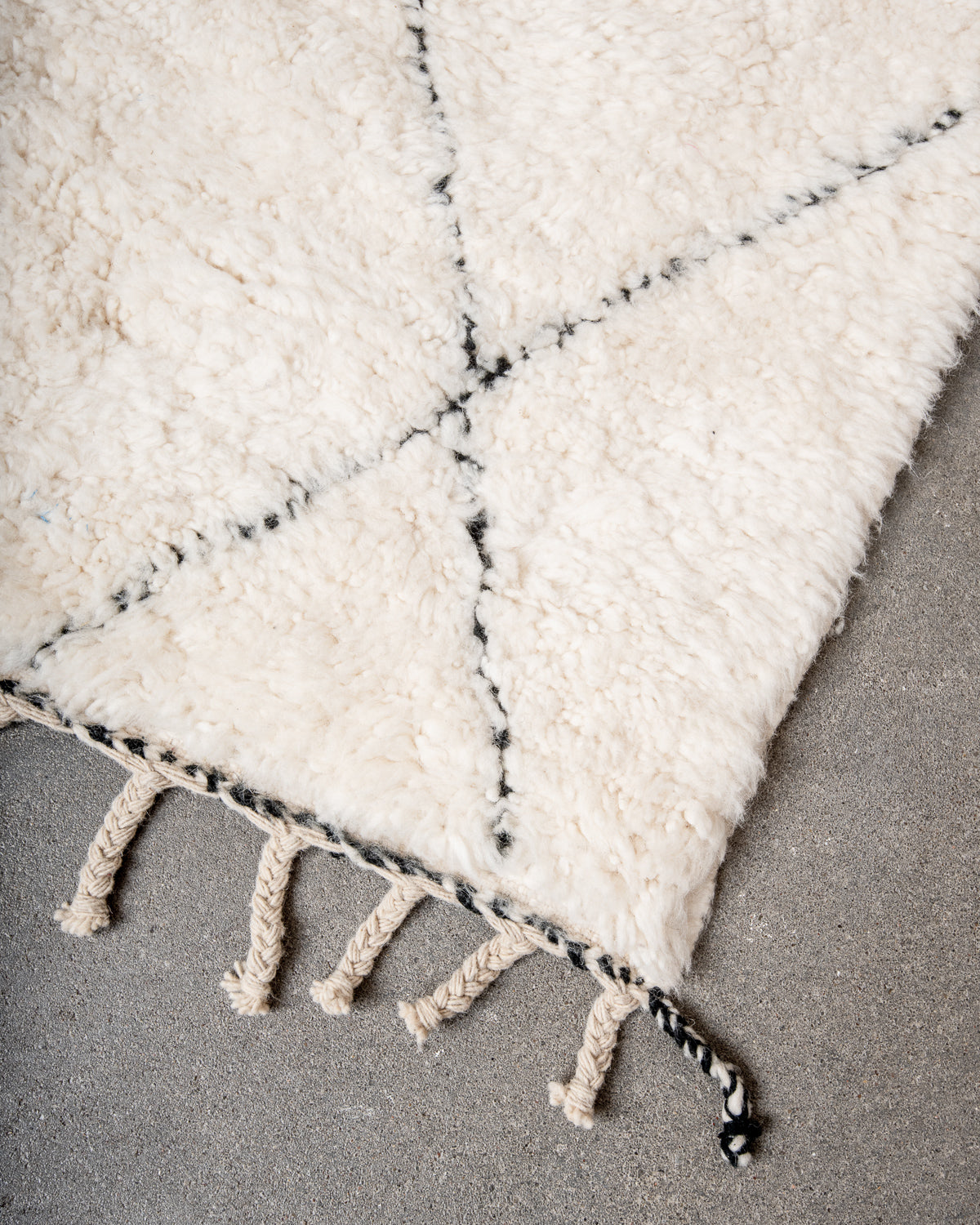 Modern, designer, handcrafted Berber rug from Morocco. Beniourain carpet with minimalist design, natural wool pile and a fluffy texture.